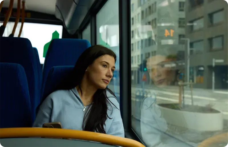 Someone looking out of a bus window